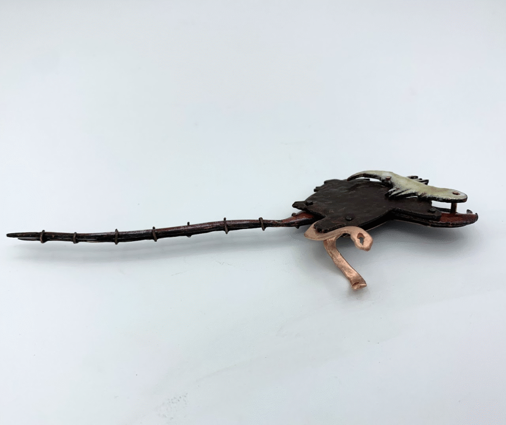 Roadkill , enamel on copper, 2 x 9 x .5 in.